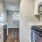 a kitchen with white cabinets
